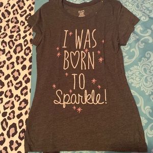 Grey T-shirt that says “ I was born to sparkle”